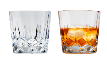 Perfect glasses of whiskey and ice isolated