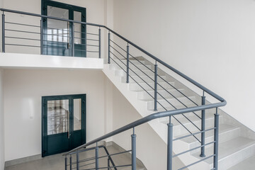 Fototapeta premium stairs emergency and evacuation exit stair in up ladder in a new office building.