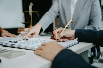 Legal counsel presents to the client a signed contract with legal law. justice and lawyer concept in office.