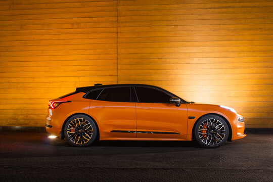 orange sports car Zeekr 001 modern Electric car