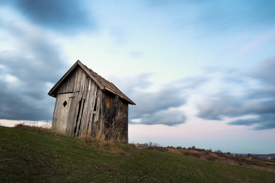 Small hut on a field with long exposure clouds in Burgenland