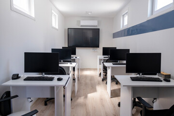 Small Portable Classroom made from a shipping container. computers and tv.