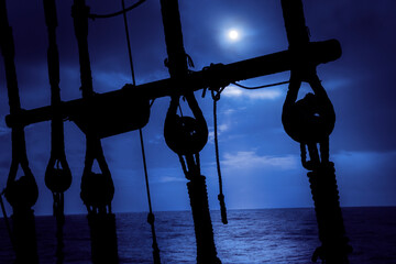 Moonlight navigation. Ancient navigation gears against moonlight at darkness night