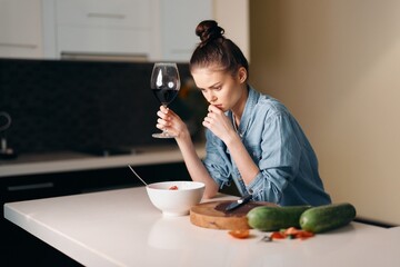 Beauty and Health: Attractive Caucasian Woman Enjoying a Fresh, Healthy Meal in a Modern Kitchen