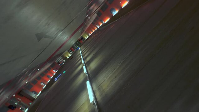 Empty underground car parking lot orbit vertigo wide angle travel shot