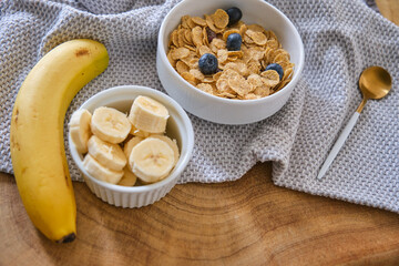 Smoothie bowl with banana, blackberries and muesli on wood table. Healthy eating, healthy lifestyle
