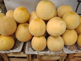 A display of fresh melon for sale in the fruit market