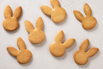 Easter pattern of homemade cookies bunny shaped on white background. View from above. Festive food...