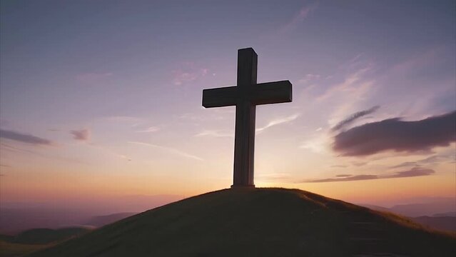 The power of faith. Silhouette of cross on a hill, at sunset.