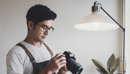 photographer taking digital photographs with his digital photo camera