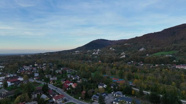 Scenery of the town and health resort in Ustron on the hills of the Silesian Beskids, Poland. Aerial drone view of beskid mountains in Ustron. Ustron Aerial View.