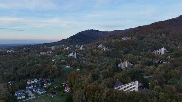 Scenery of the town and health resort in Ustron on the hills of the Silesian Beskids, Poland. Aerial drone view of beskid mountains in Ustron. Ustron Aerial View.