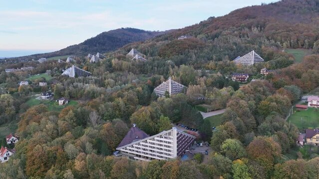 Scenery of the town and health resort in Ustron on the hills of the Silesian Beskids, Poland. Aerial drone view of beskid mountains in Ustron. Ustron Aerial View.