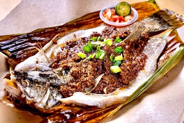 asian fresh wok fried bbq grilled seafood seabass garuper fish with spicy onion chilli sambal sauce lime in banana leaf cafe hotel luxury halal vegan food restaurant banquet menu