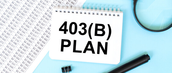 403 b Plan message on notepad with financial background and blue tint