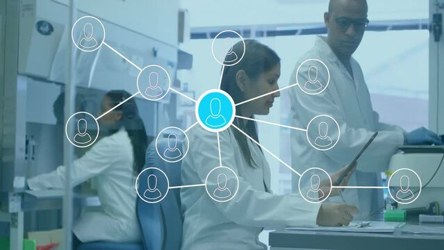 Animation of network of people icons over diverse scientists at work in laboratory