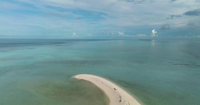 Aerial drone of sandy beach with crystal clear water in the tropics. Timba Timba islet. Tun Sakaran Marine Park. Borneo, Sabah, Malaysia.