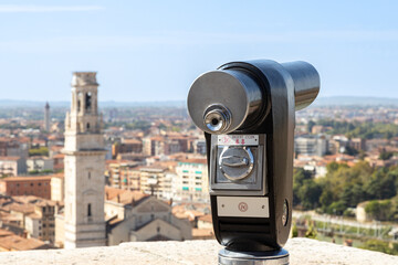 View of a coin operated telescope. Verona city defocused in background
