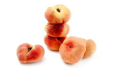 Several saturn peaches or flat peaches isolated on white background with clipping path..