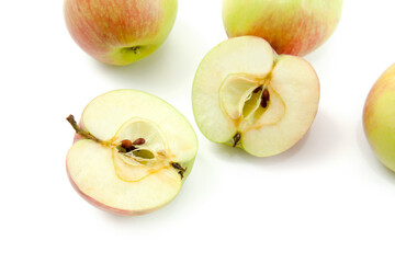 Half and whole of green apples isolated on white background with clipping path..