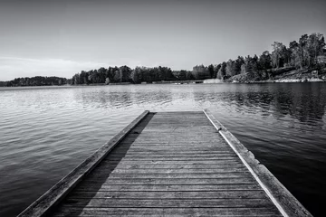  Wooden jetty on the lake in Sweden. Black and white photo. © Jiri Dolezal