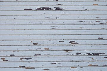 Closeup of old wood wall with peeling paint.