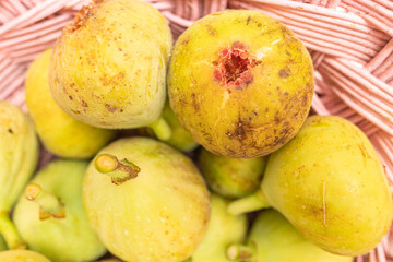 selective focus, organically grown figs in a wicker basket. Top view