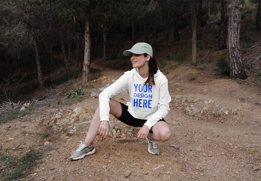 Mockup of woman wearing customized hoodie, crouching
