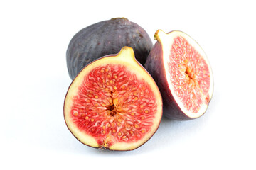whole and halved figs isolated on white background