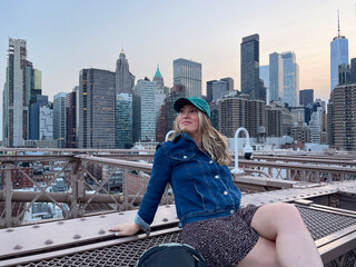 Tourist woman on Brooklyn Bridge in New York