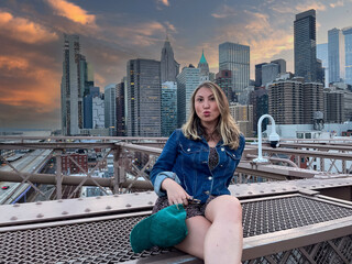 Tourist woman on Brooklyn Bridge in New York