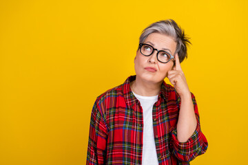 Portrait of focused concentrated person finger touch temple look empty space brainstorm isolated on...