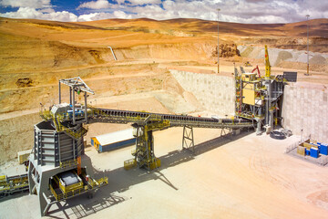 Rock crusher and conveyor belt at the plant of a copper mine in the altiplano of the Atacama Desert...