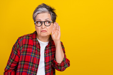 Portrait of interested aged person hand near ear look eavesdrop listen empty space communication...