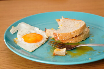 an egg is cut into slices and placed on a plate