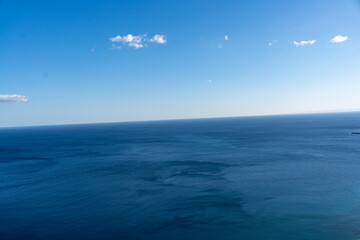 The sky is blue and the ocean is calm