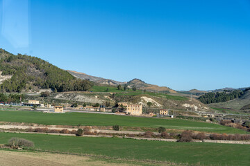 Fototapeta premium A beautiful landscape with a small village in the middle of it