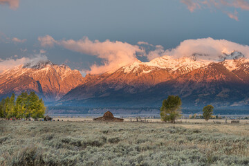 Teton Range and Mormon Row Historic District at Antelope Flats in Grand Teton National Park during sunrise in Wyoming - 753005056