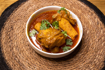 Beef Nali Nihari or Nolar Jhol served in dish isolated on wooden background side view indian spices, bangladeshi and pakistani food