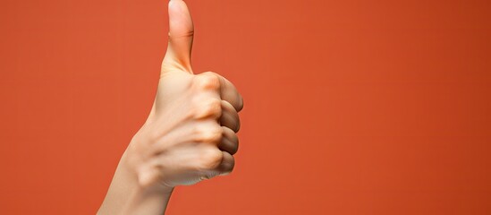 Expressive Hand Gesture with Thumb Up Sign Showing Approval and Positivity - obrazy, fototapety, plakaty