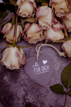 background with antique roses on concrete background with text and sign: " for you"