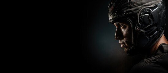 Determined Cyclist in Helmet Against Moody Black Background Showing Strength and Focus - obrazy, fototapety, plakaty