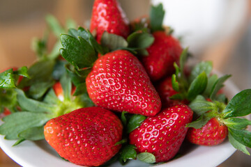fresh red strawberries are on the table