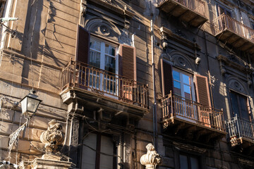 The building has a lot of windows and balconies