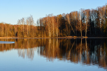 a beautiful view of the lake in the sunny spring evening sun