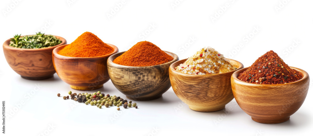 Poster a row of bowls with different colored spices in them. the bowls are lined up next to each other, wit