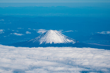 Plane View of Mountain Fuji surrounded by sea of clouds, Japan