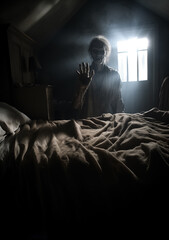 Fototapeta premium Horror silhouette in window with curtain inside bedroom at night. Horror scene. Halloween concept. human monster creature Blurred silhouette of ghost