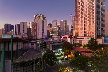 Fototapeta premium Makati, Philippines - Stunning twilight aerial view of Makati City skyline as seen from Legazpi village..