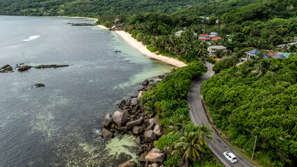 panoramic view from a drone of the sea bays and beaches on a sunny day of the Seychelles islands